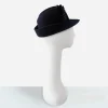 1960s designed by Sylvia hat Early 1960s navy blue wool felt hat with upturned back brim, profile view.