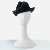 1960s designed by Sylvia vintage hat Early 1960s navy blue felt hat on mannequin, showing directional velvet trim.