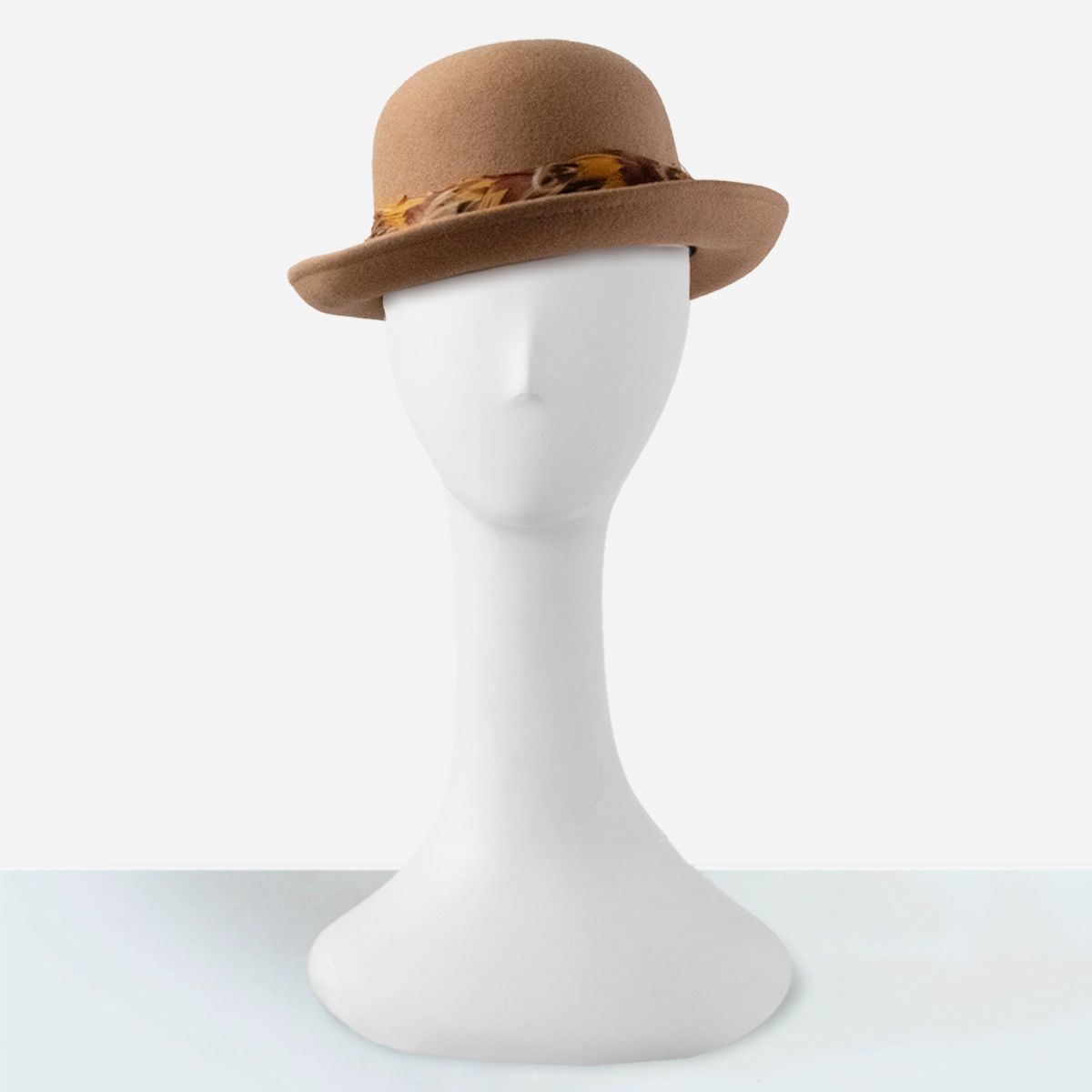 Camel wool bowler hat with upturned brim and feather band on mannequin