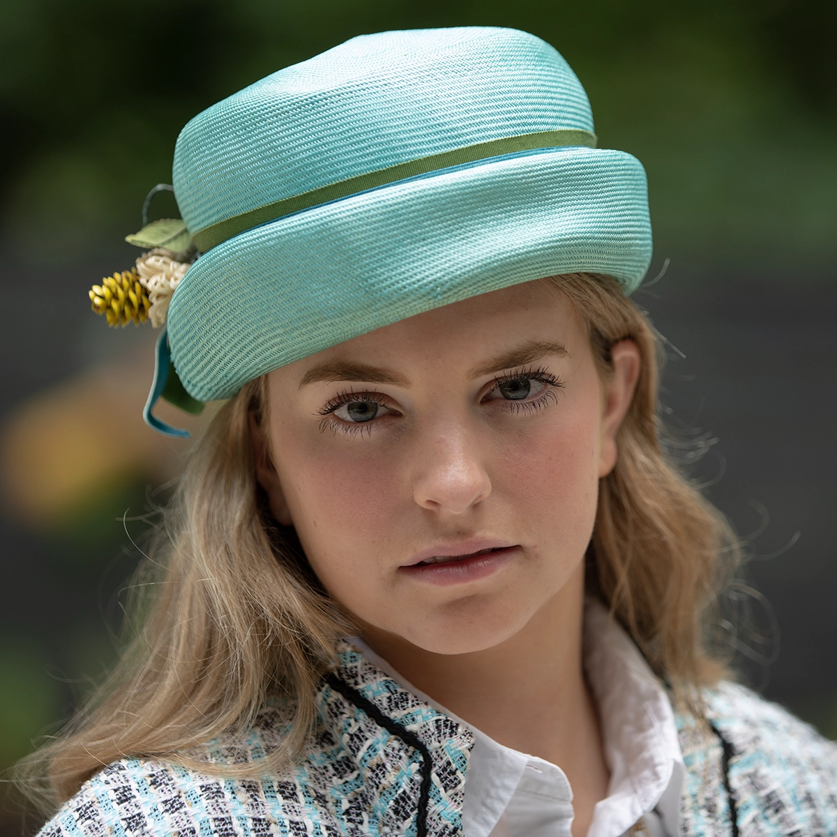 shop vintage spring hats. Model wearing blue straw turban