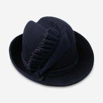 Early 1960s navy blue sculptural felt hat with velvet ruffle trim, side view.