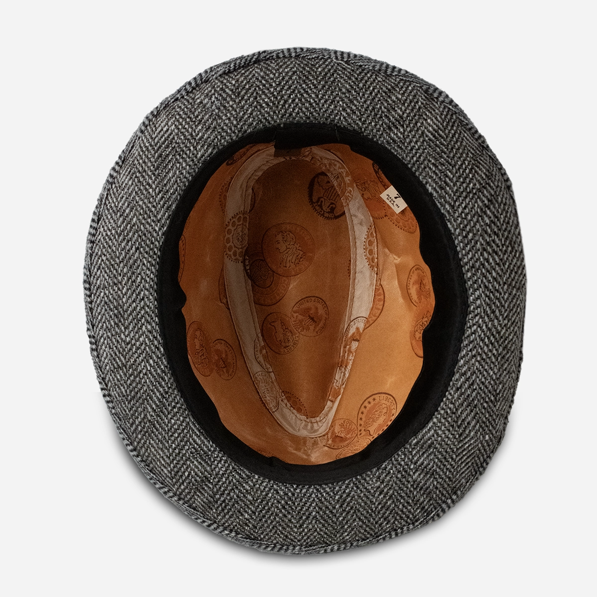 interior of vintage trilby hat with copper satin coin print lining