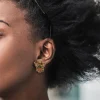 woman wearing Asian style earrings woman wearing Asian style earrings