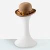 Camel wool bowler hat with upturned brim and feather band.