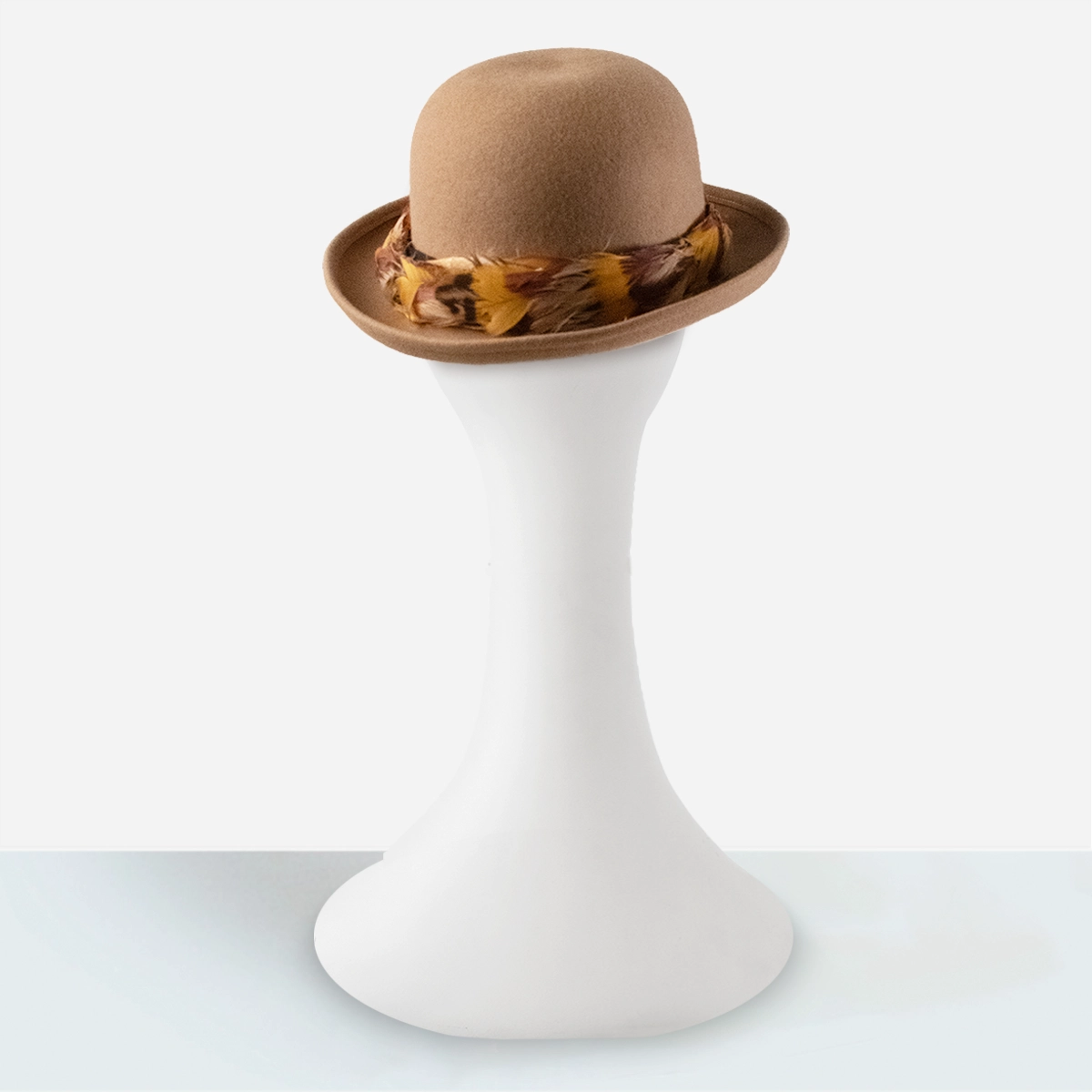 womens tan bowler derby hat Camel wool bowler hat with upturned brim and feather band.