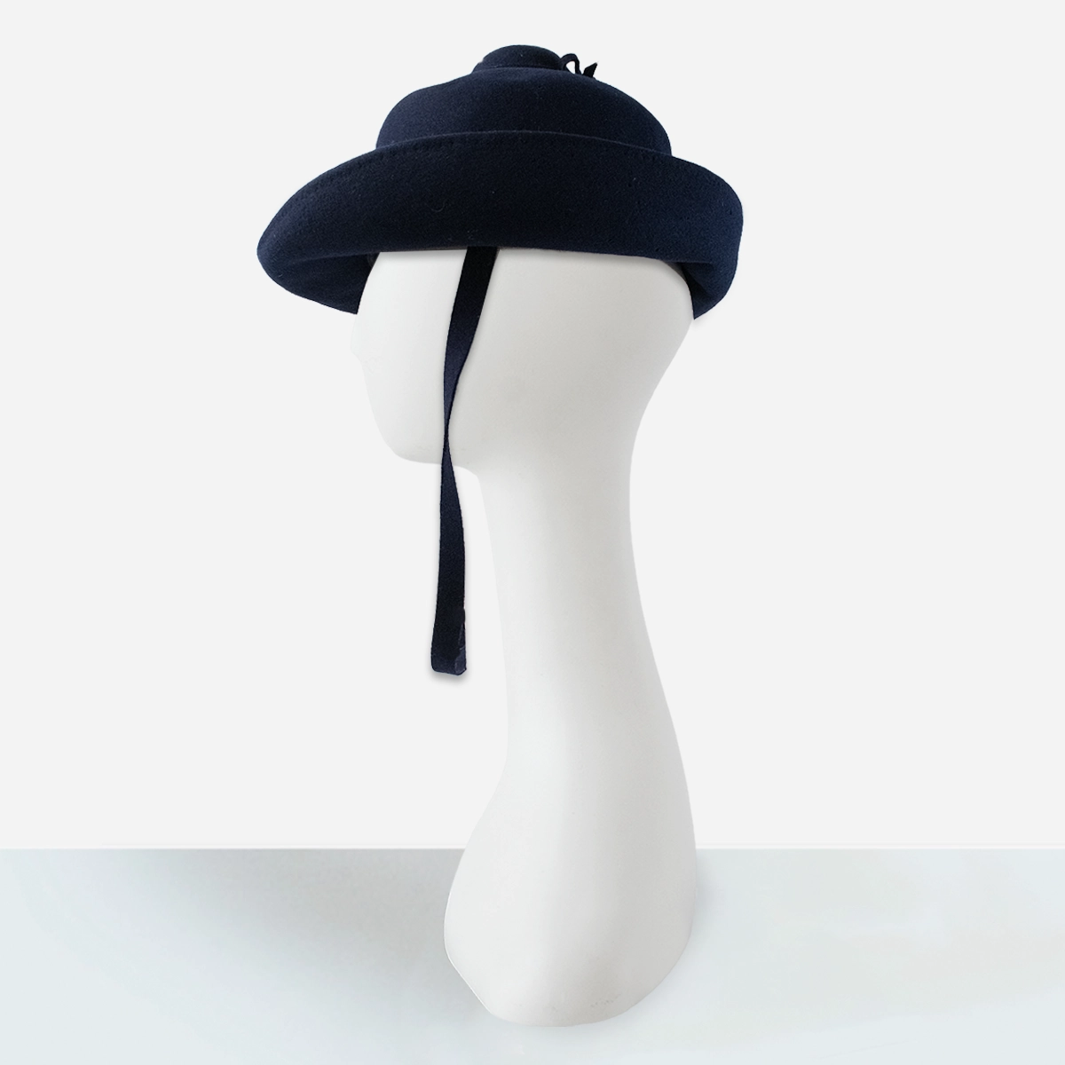 Profile of sculptural tiered dome crown on 1960s Breton hat.