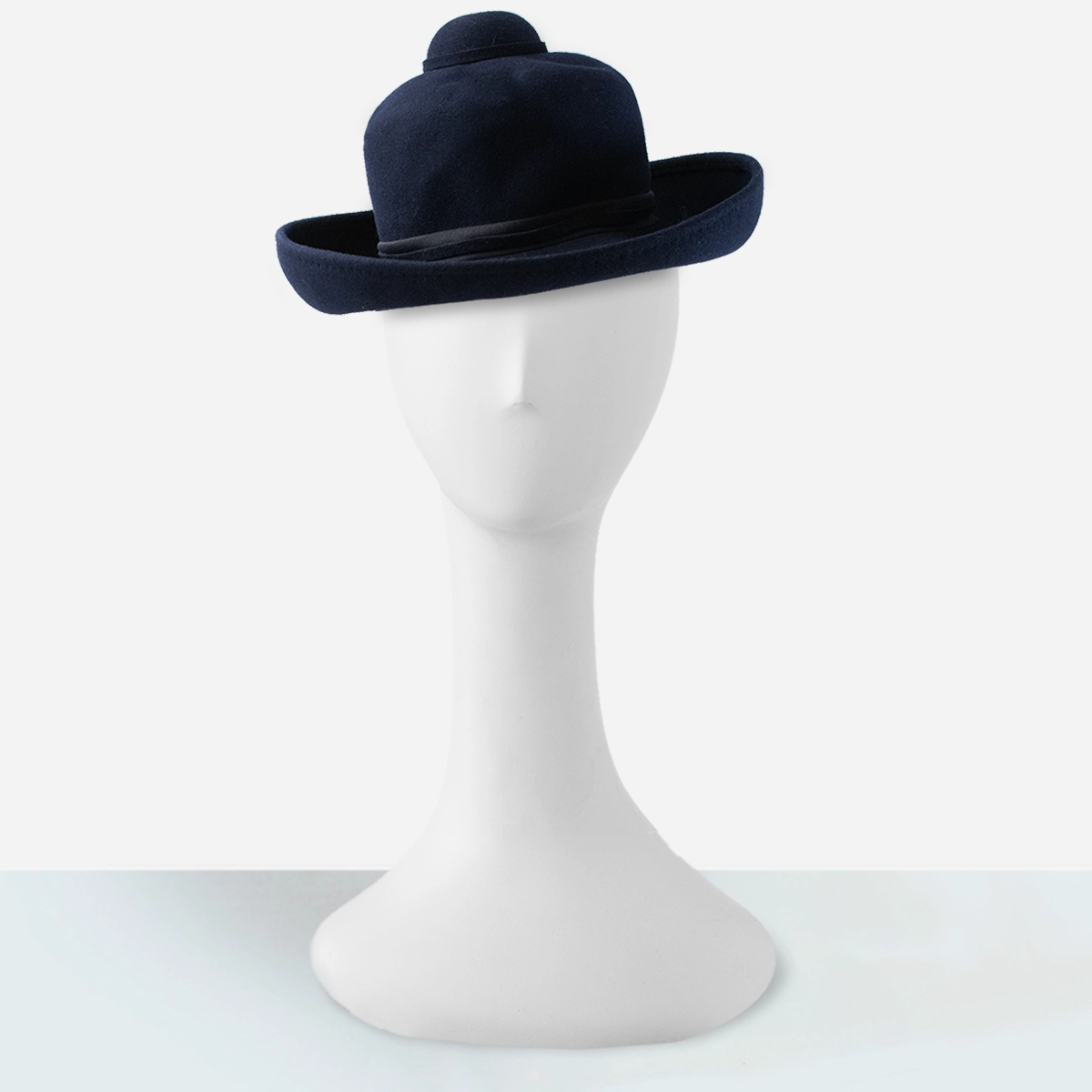 Front view of vintage navy wool Breton hat with adjustable chin tie.