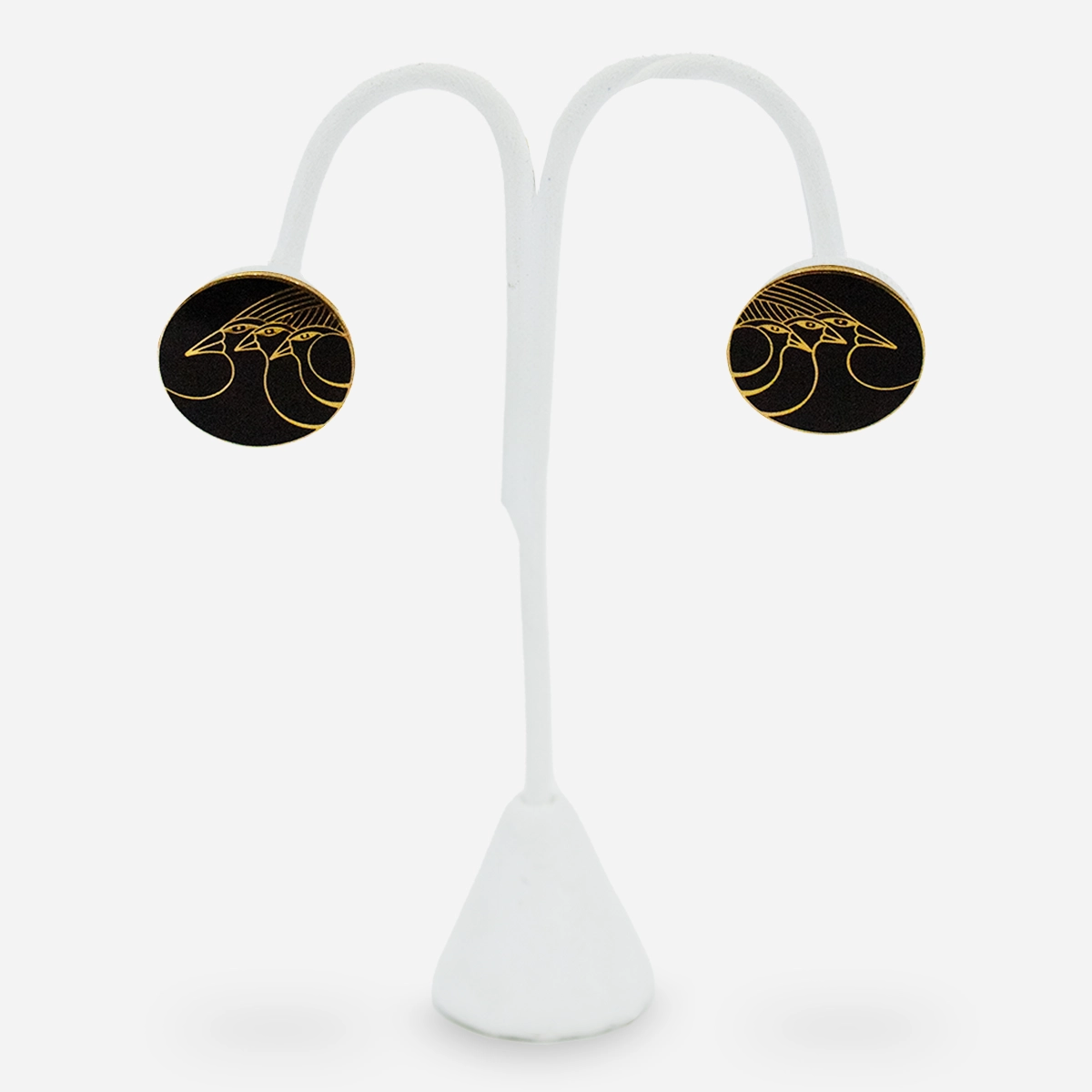 Laurel Burch bird motif enamel earrings on display stand.