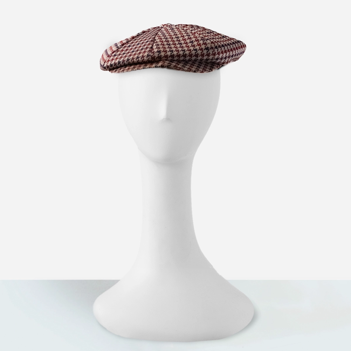 vintage burgundy houndstooth newsboy cap on mannquin