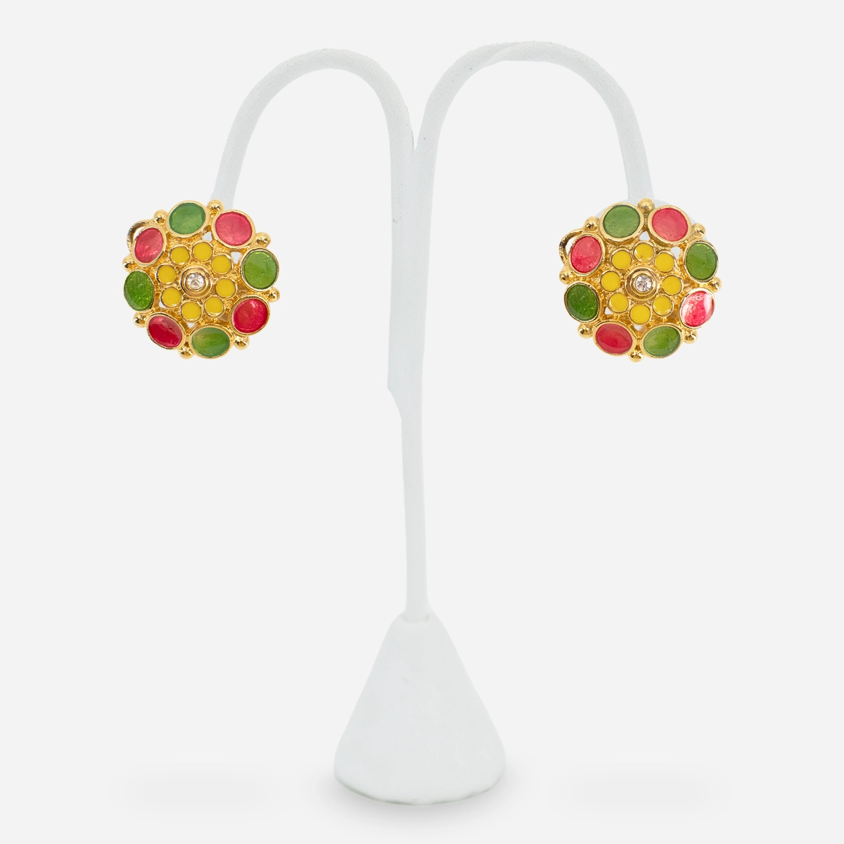 Vintage Avon enamel floral clip earrings with orange yellow and green enamel petals and crystal center on stand