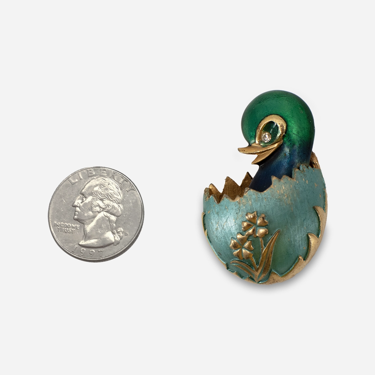1950s Easter brooch featuring a chick hatching from an egg.