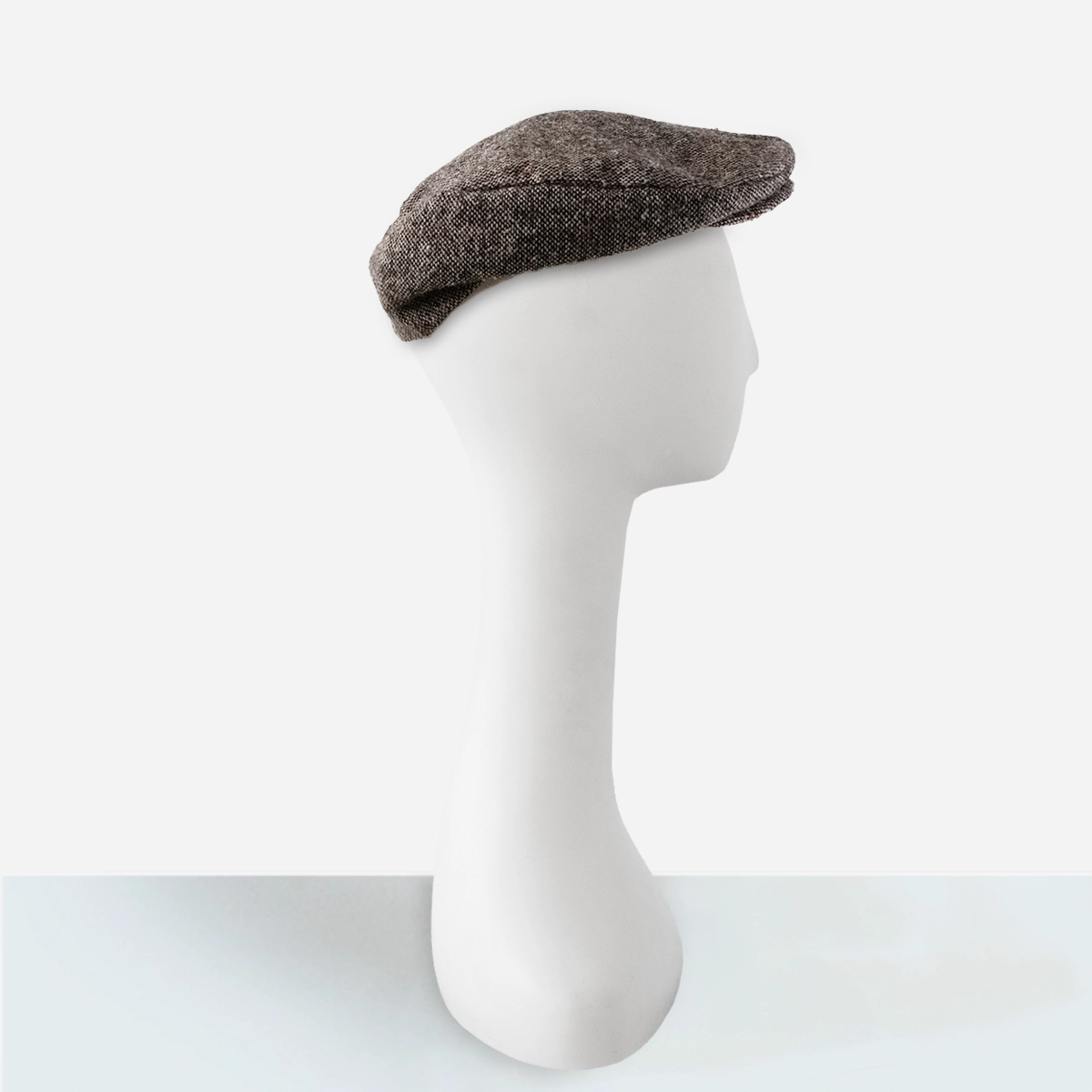 vintage mens gray tweed driving cap side view on mannequin