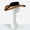1950s wide brim straw cartwheel hat Side view of vintage straw cartwheel hat with black velvet trim and wide brim