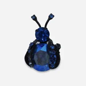 Vintage Warner blue rhinestone bug brooch with faceted body stone and japanned metal
