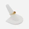 14K gold birthstone ring with topaz glass stone and sculptural modernist setting.