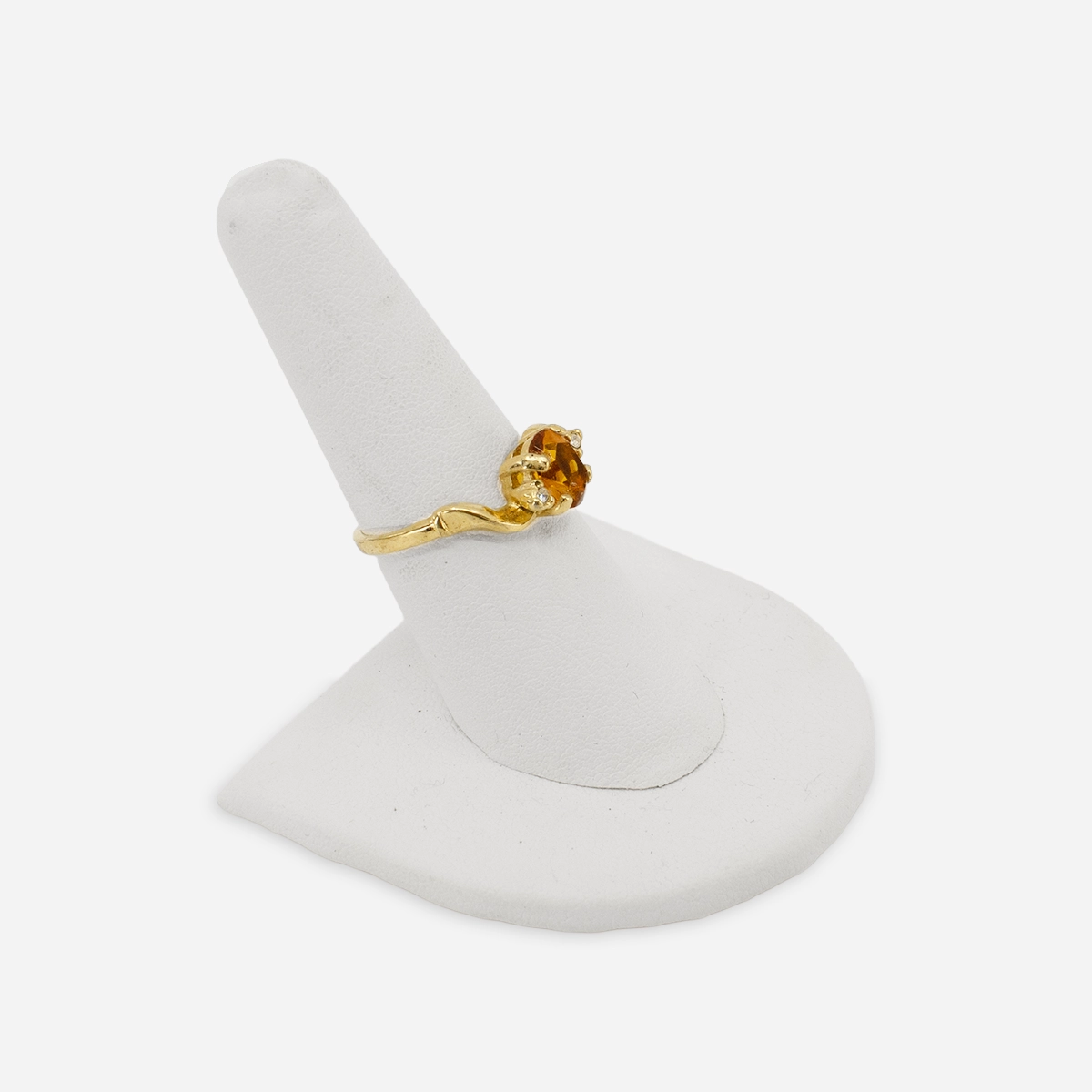 14K gold birthstone ring with topaz glass stone and sculptural modernist setting.