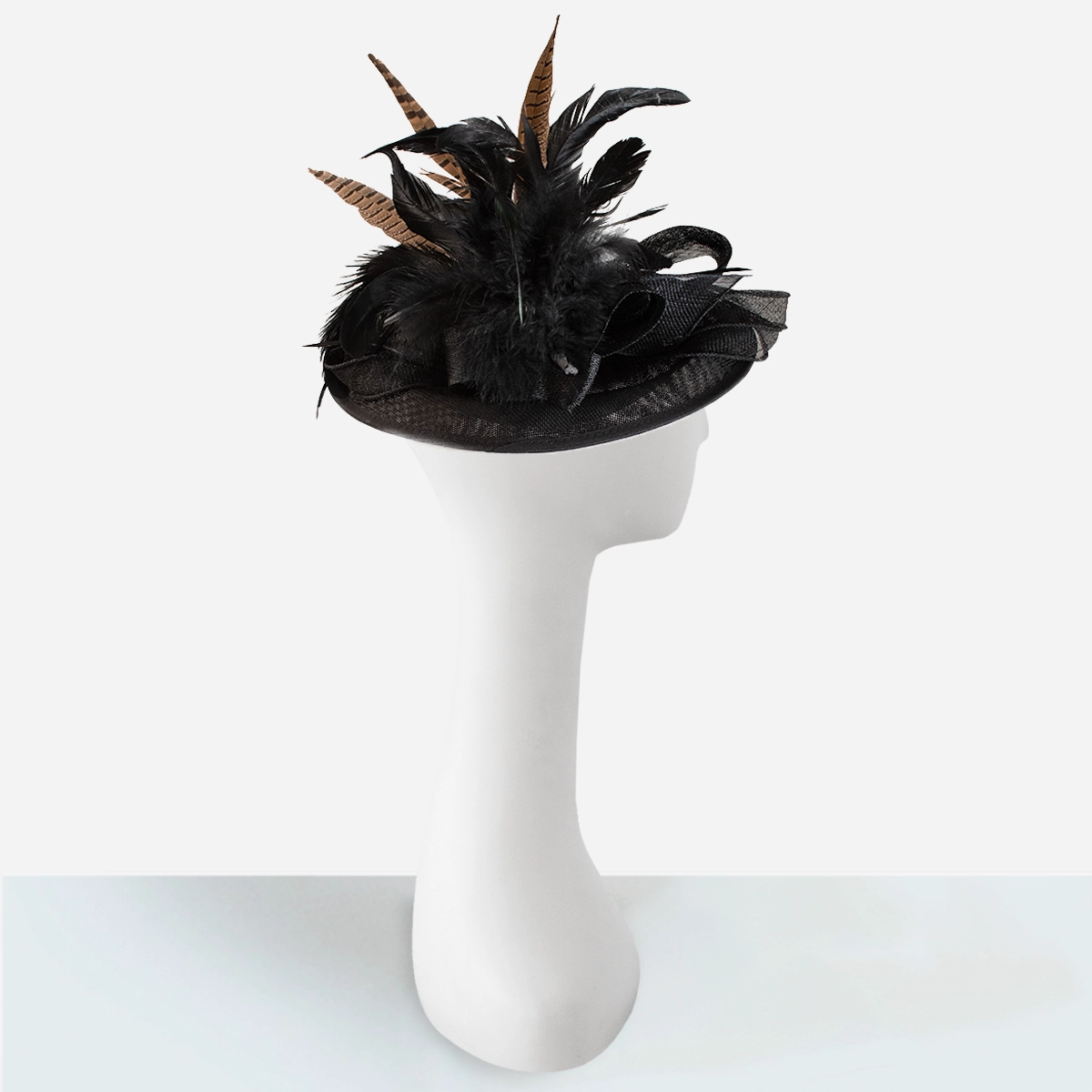 black derby tilt hat with pheasant feathers side profile