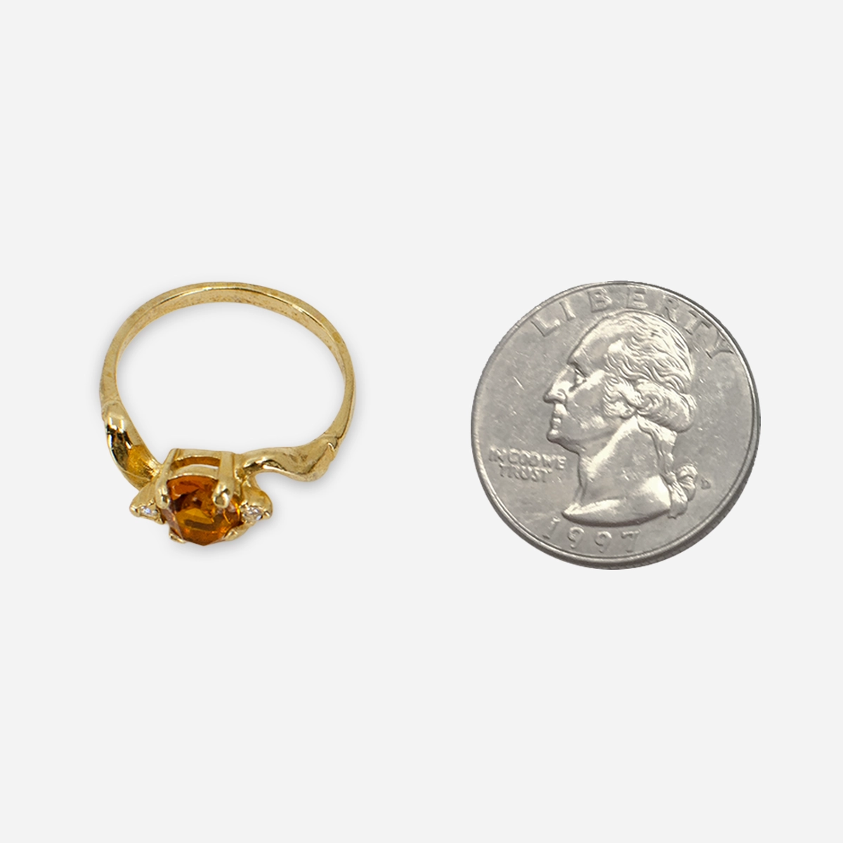 14K gold ring with amber glass stone and sculptural modernist setting.