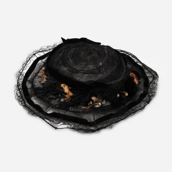 Top view of black horsehair Edwardian hat with velvet ribbon trim.