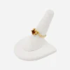 Vintage 14K gold modernist ring with topaz-colored glass center, side view.