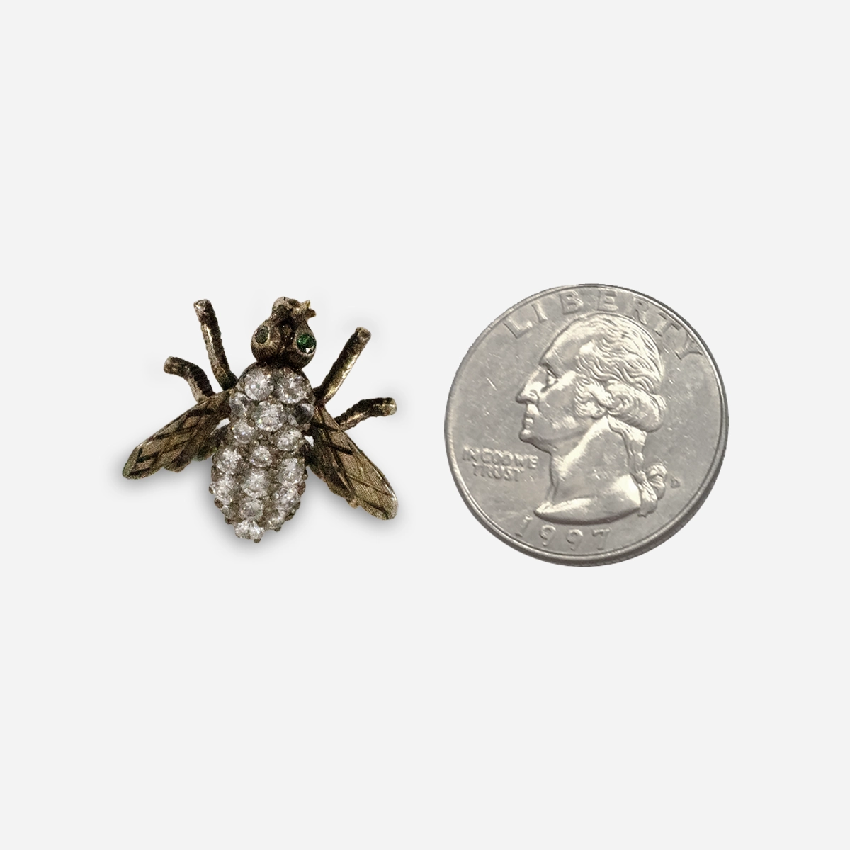 Small vintage fly scatter pin size comparison with quarter