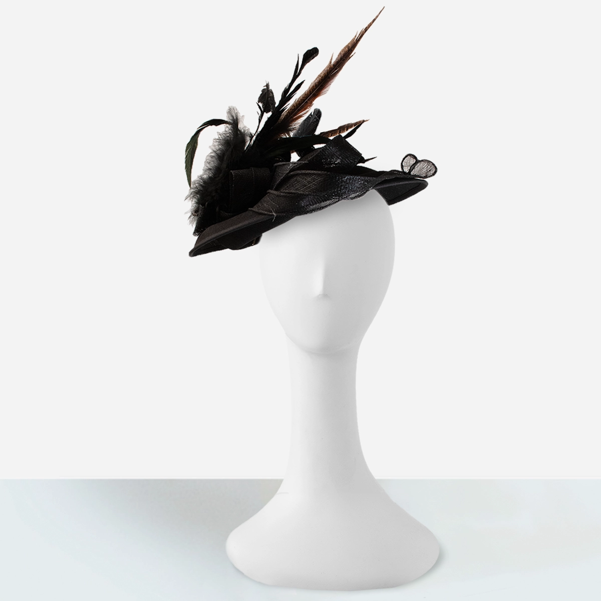 vintage black sinamay tilt hat angled on mannequin