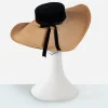 vintage cartwheel hat Detail of vintage straw cartwheel hat with black velvet edge trim and woven straw, rear view