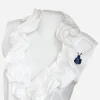 Vintage Warner blue rhinestone bug brooch styled on white ruffle blouse