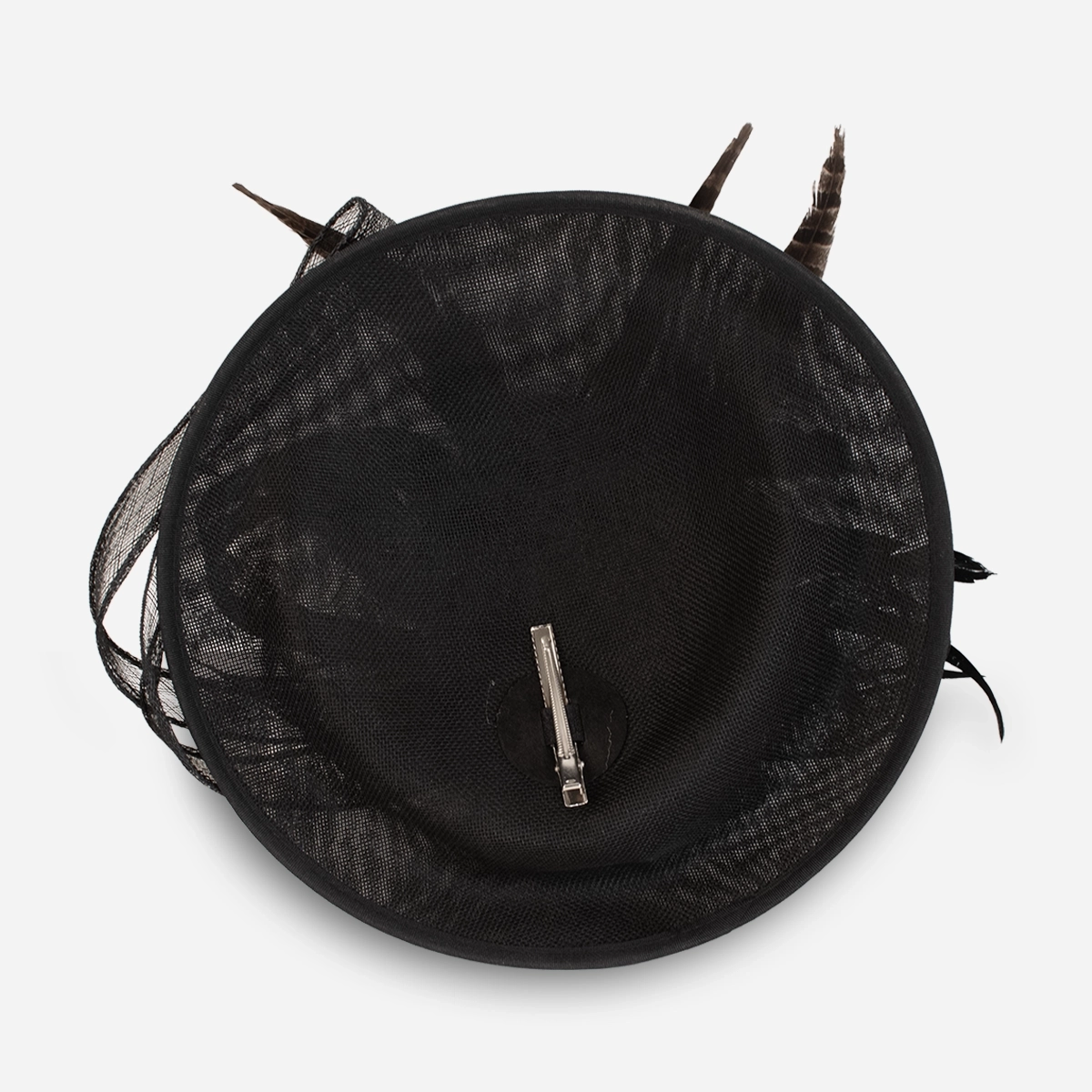 black feather tilt hat underside showing hair clip