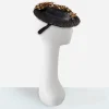 1930s black straw tilt hat 1930s Carson Pirie Scott black straw tilt hat with fuzzy floral veiling and red silk flower spray.