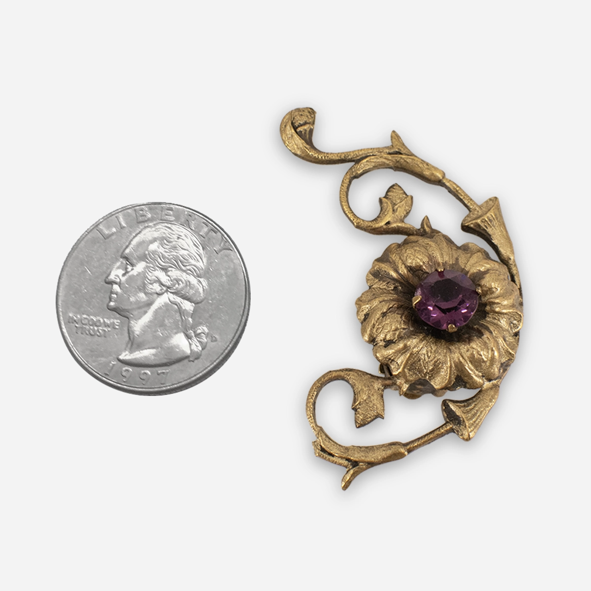1950s Joseff purple clip earrings with Art Nouveau inspired botanical design.