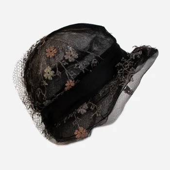 Antique Edwardian black net hat with orange pink and gold silk floral trim side view.