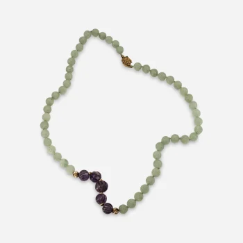 1960s green aventurine necklace with fluted purple glass beads and gold-tone spacers.
