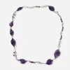 Vintage long purple glass necklace featuring irregular faceted beads and silver-tone openwork links.