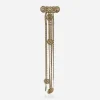 Long vintage gold-tone chatelaine brooch featuring cascading chains and faux pearls.