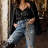 gold & pearl chatelaine brooch on jeans