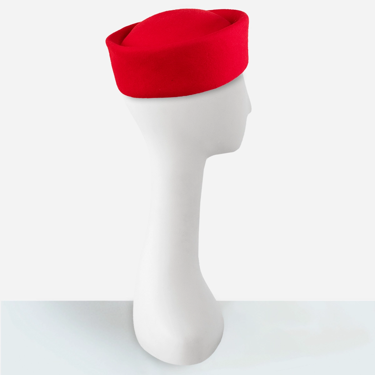 Vintage red pillbox hat by betmar wool felt design.