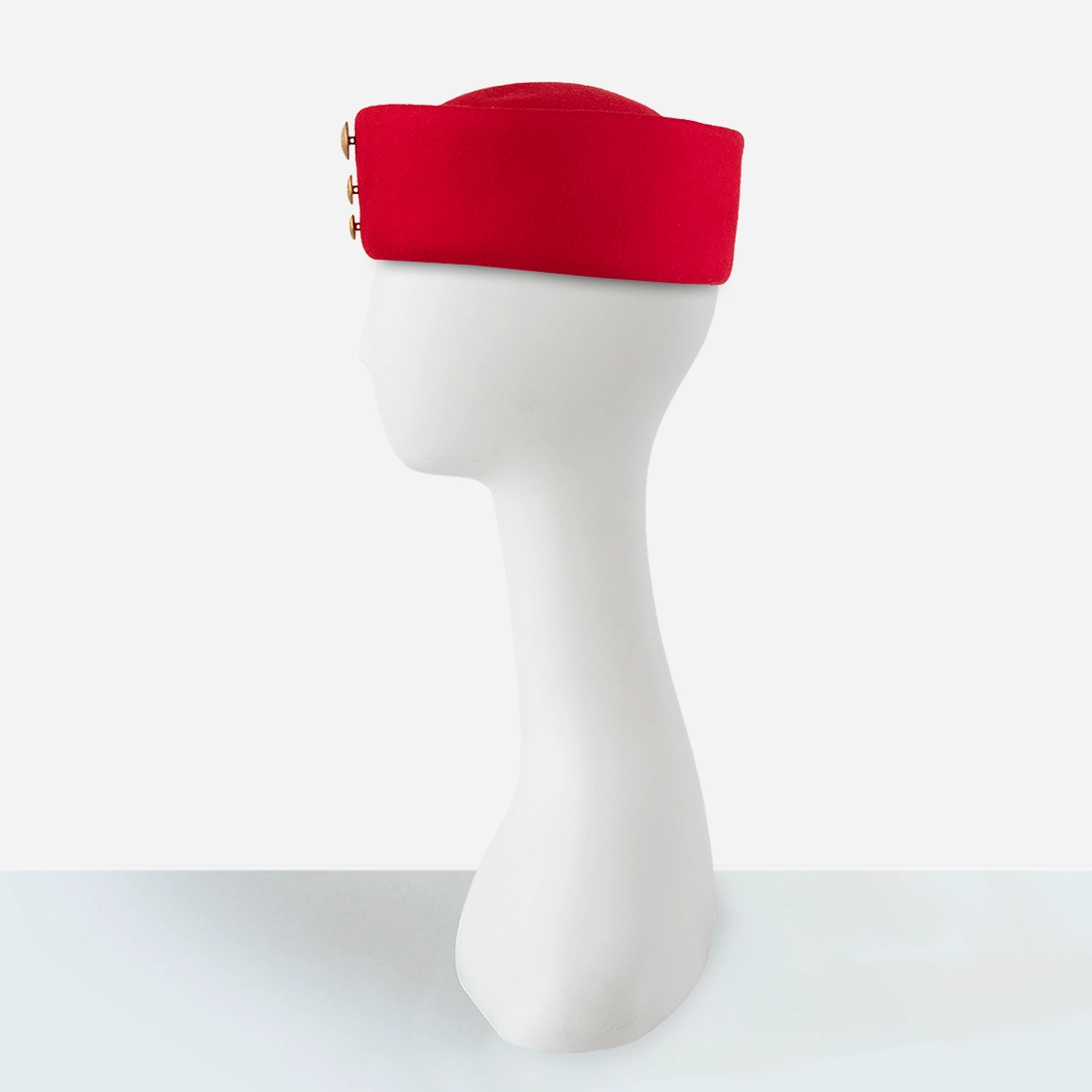 Vintage red pillbox hat with structured wool felt design side view