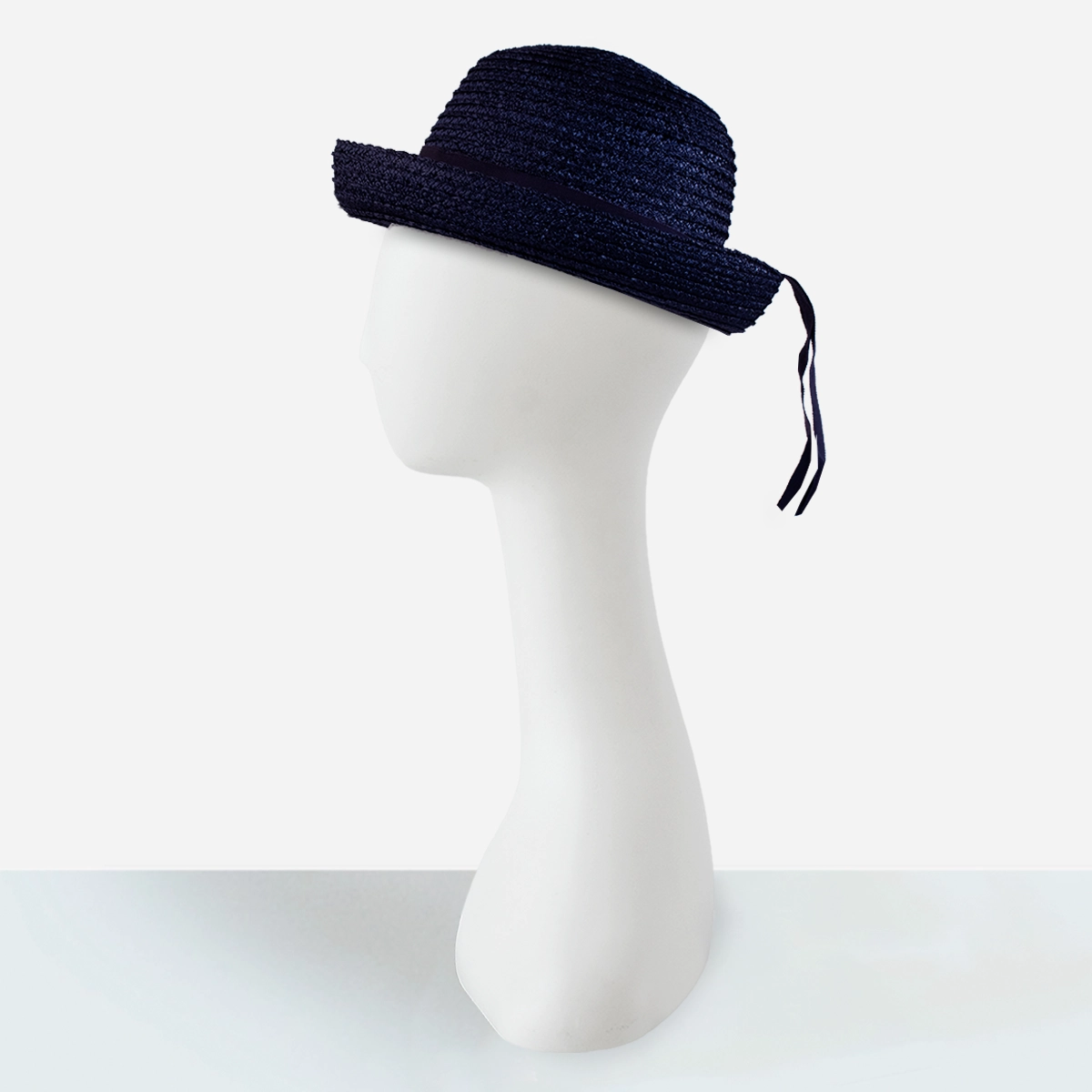 vintage 1960s womens hat 1960s navy blue straw roller hat with trailing grosgrain ribbon detail side view