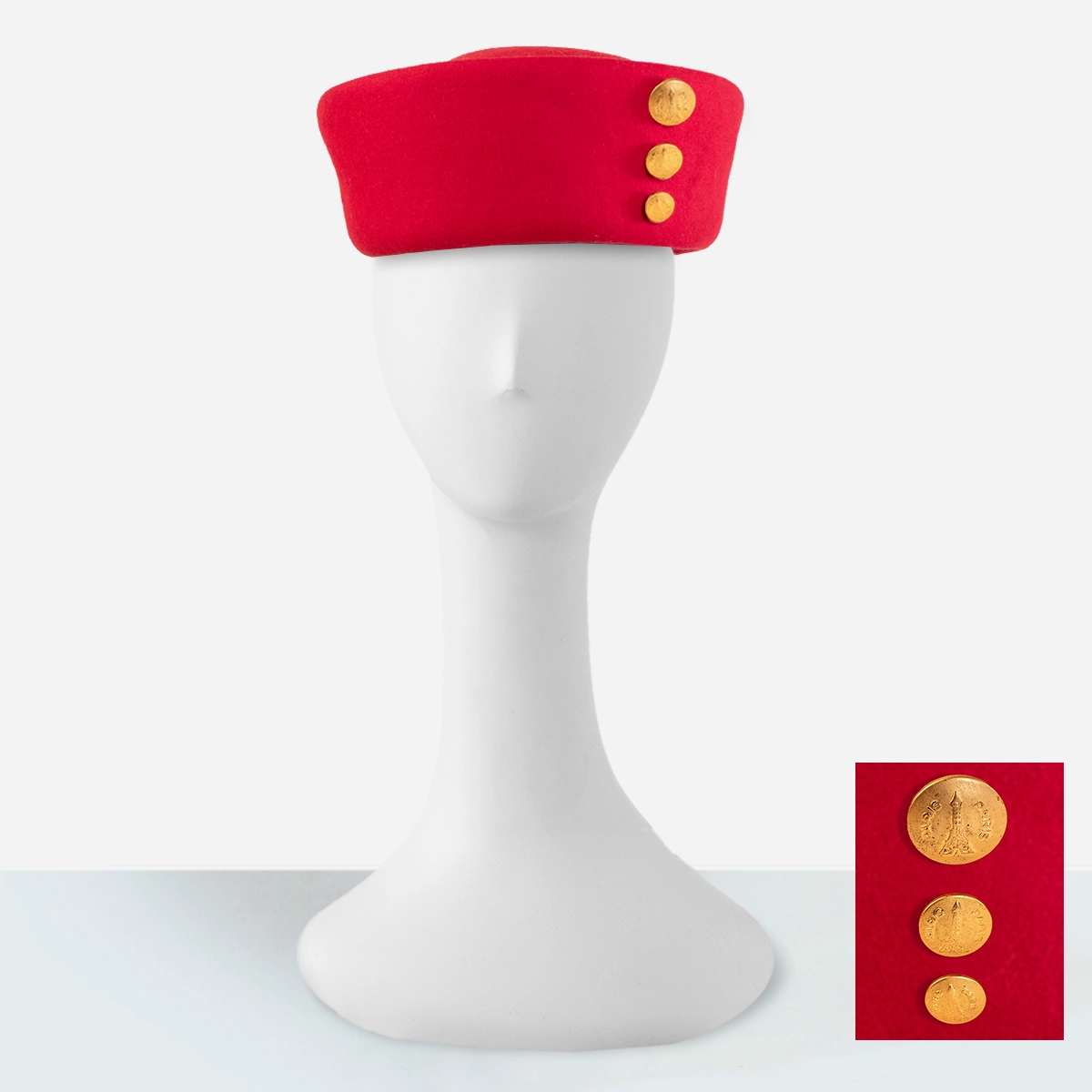 Bright red vintage Betmar hat with Eiffel Tower gold buttons.