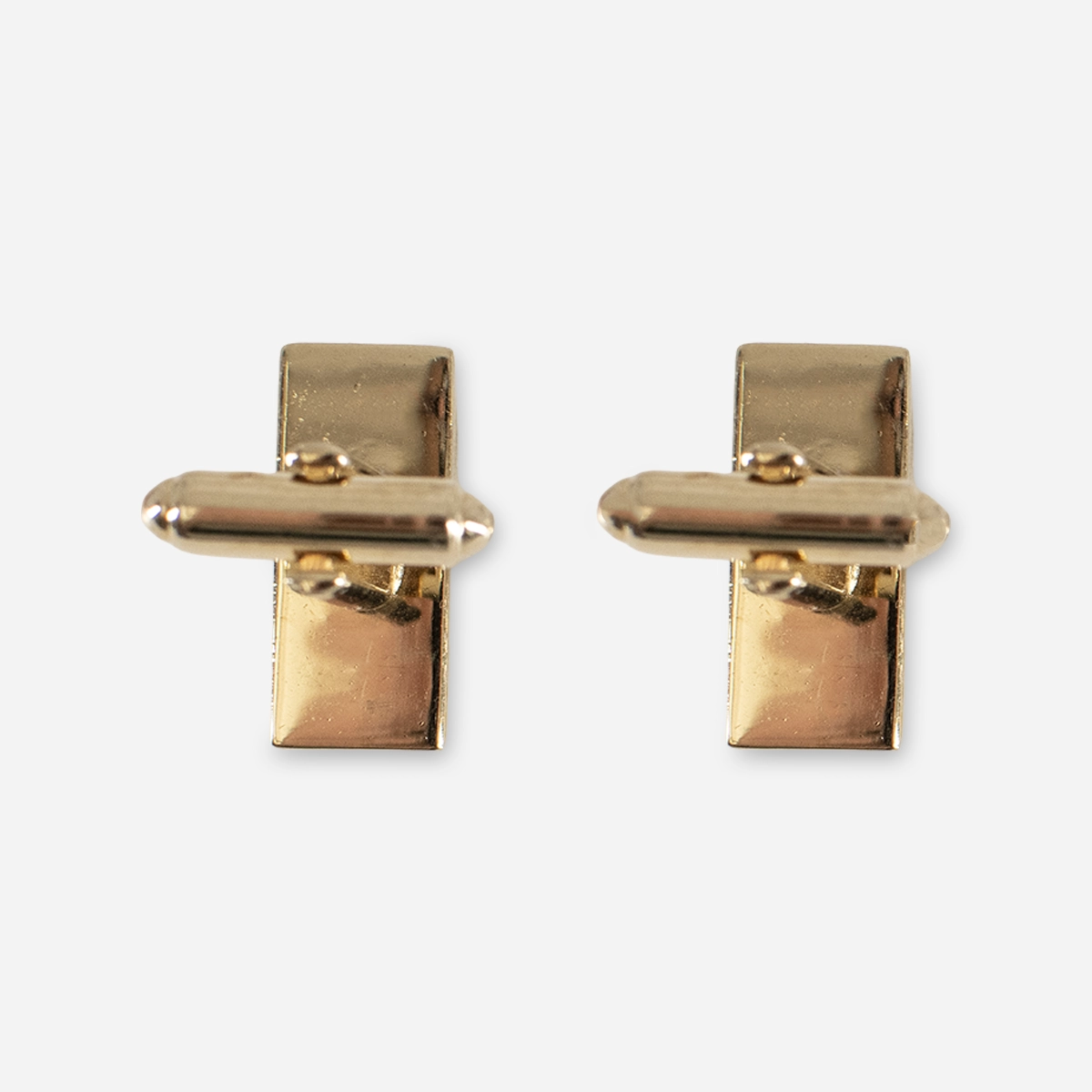 Back view of vintage goldtone bullet-and-toggle cufflinks.