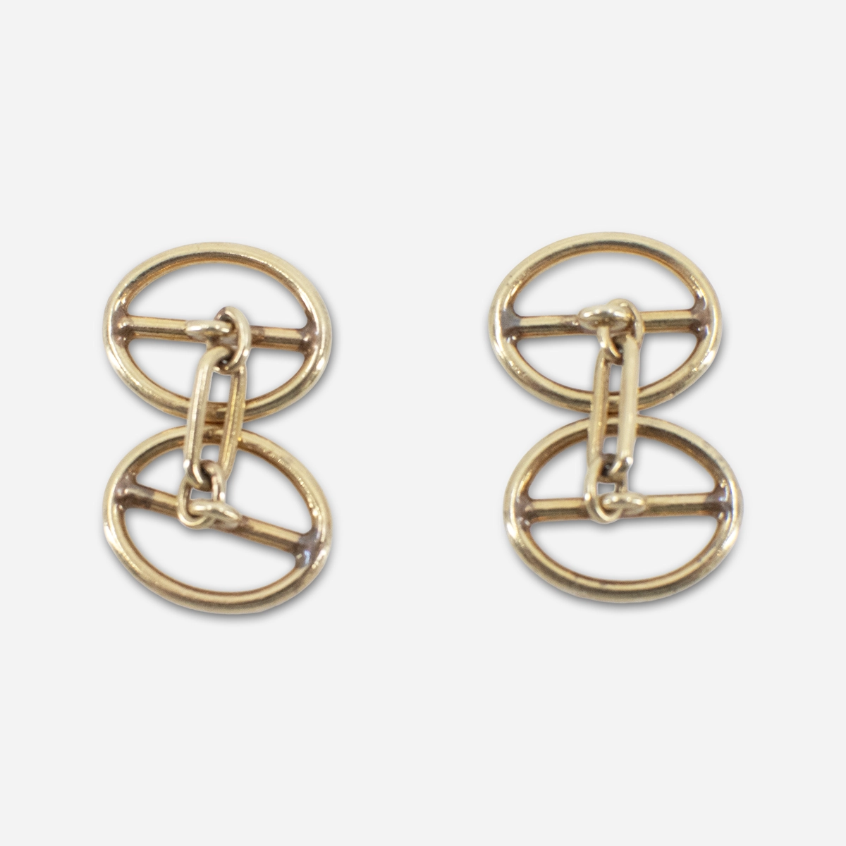 Rear view of vintage gold tone cufflinks with chain link fasteners.
