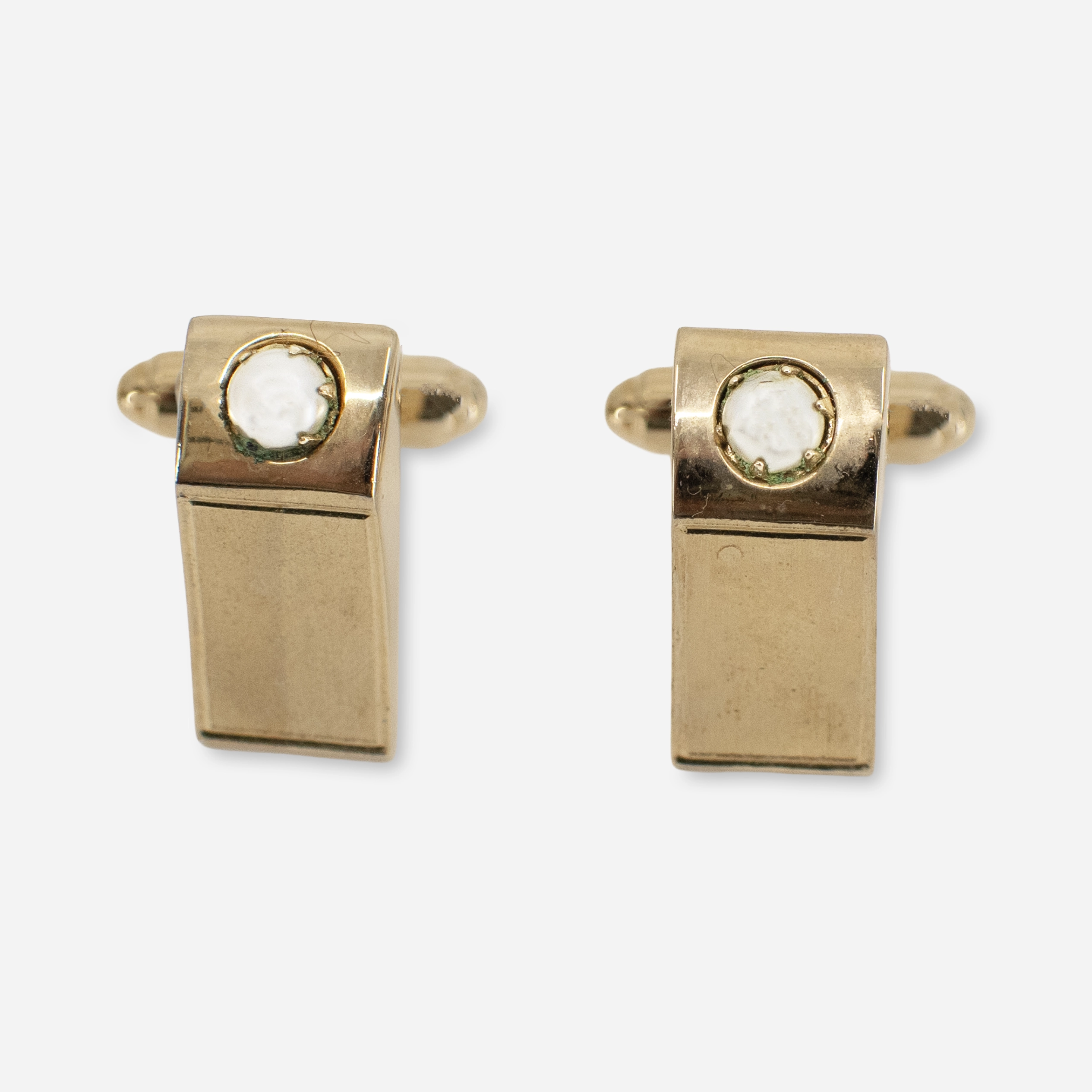 Mid-century goldtone cufflinks with prong-set faux pearl centers, shown from the front.