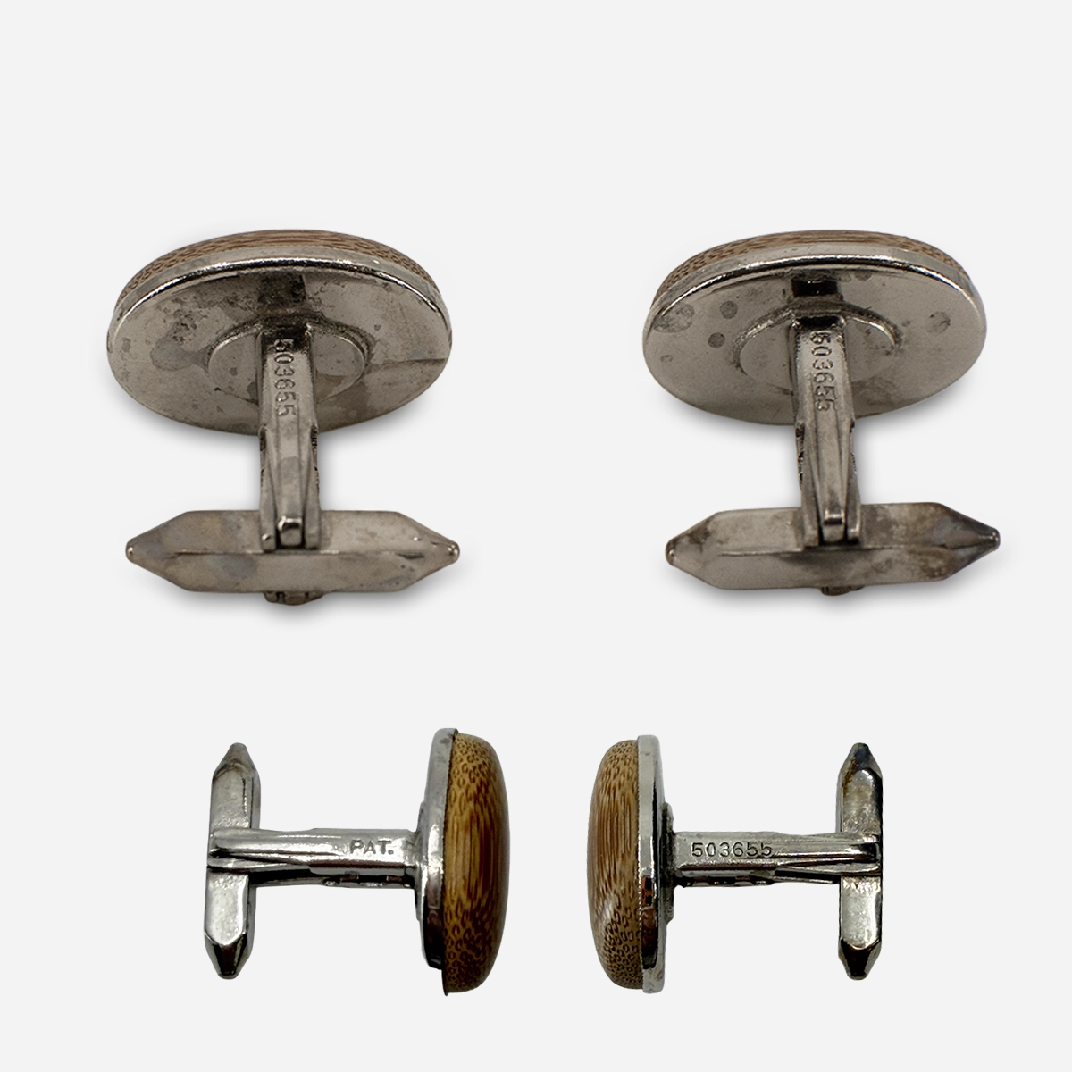 Back view of vintage Japanese cufflinks showing whale-back fittings stamped PAT. 503655.
