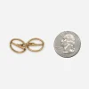 Vintage gold tone oval cufflinks shown beside a quarter for scale.