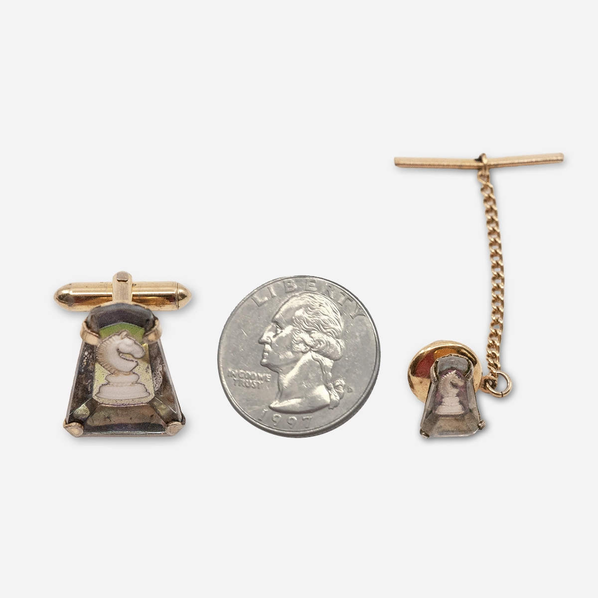 vintage swank cufflink set size Size reference showing vintage Swank chess knight cufflink and tie tack beside a quarter.