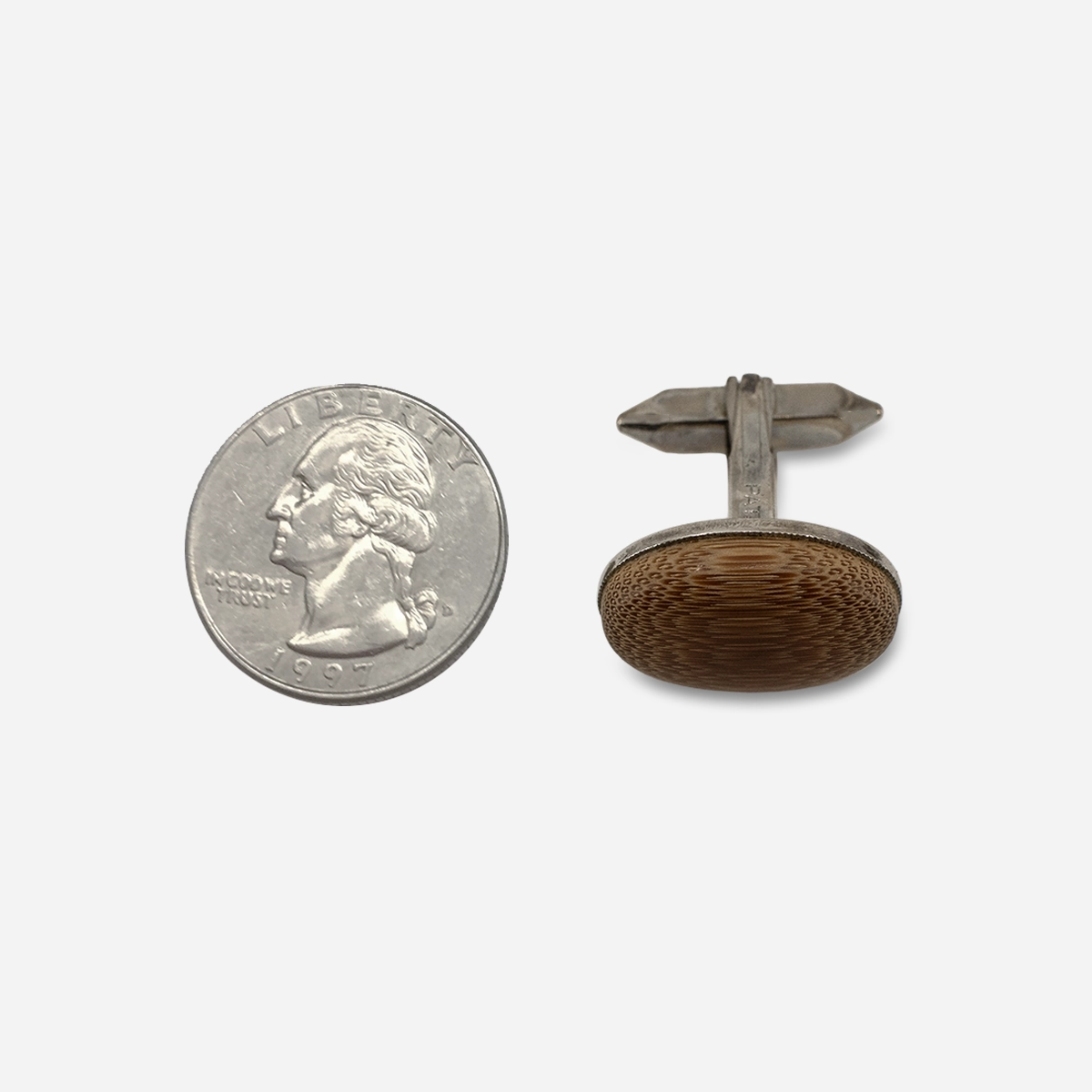 Vintage wood oval cufflink shown beside a quarter for scale, approximately .75 inch wide.