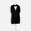 Black chanel zipper cardigan Chanel black zip-front cotton knit jacket on dress form, styled closed with neck tie draped around the collar.