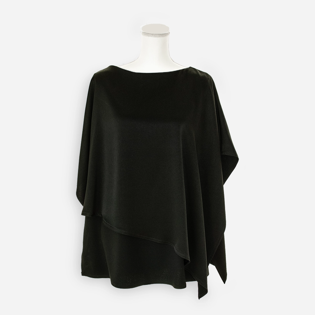Front view of black wool-blend poncho top with layered draped hem