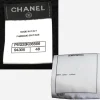 vintage chanel jacket labels Close-up of Chanel garment labels showing Made in Italy, style numbers, size label, and 100% cotton composition tag.